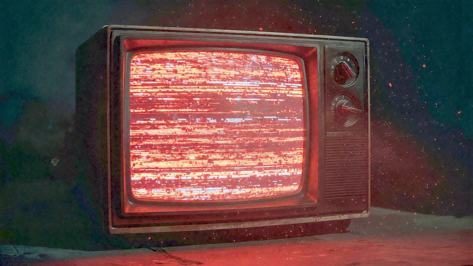 Gros plan sur un écran de télévision vintage diffusant de la neige électronique dans une lueur rouge, ambiance horreur